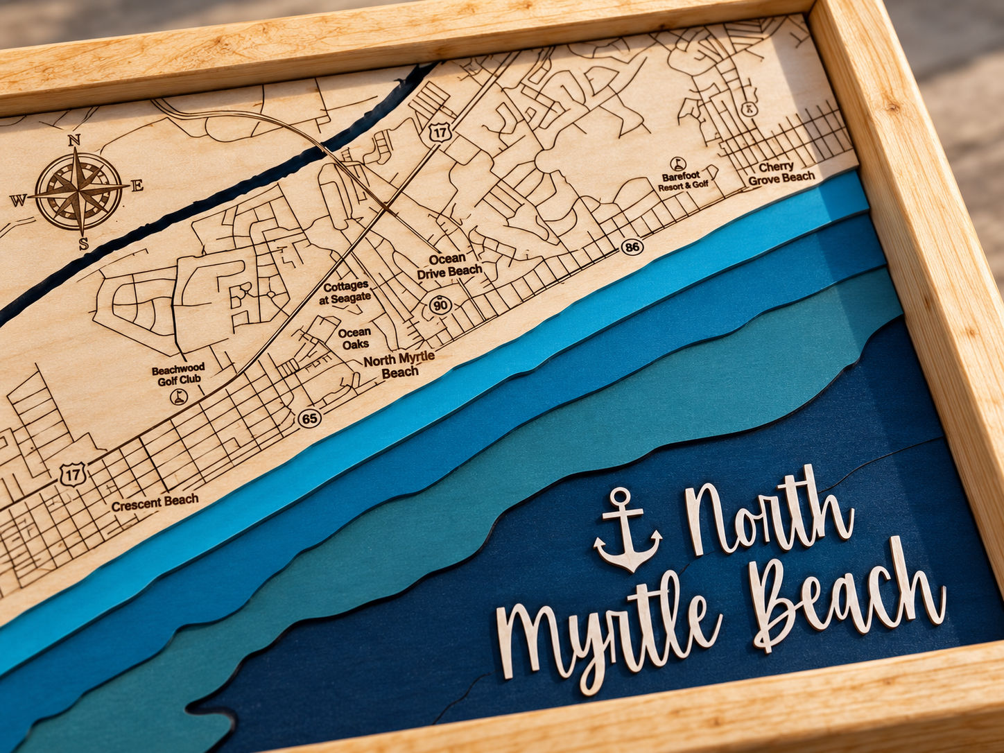 Close-up of the North Myrtle Beach engraved street grid and layered ocean